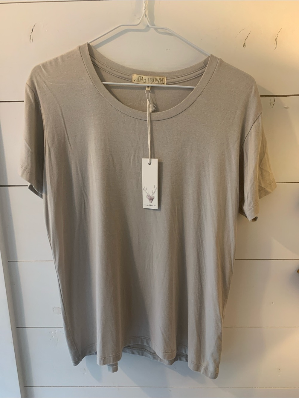 NWTS one size Jonah Brown T shirt. Greige color. Length shoulder to hem 24”.